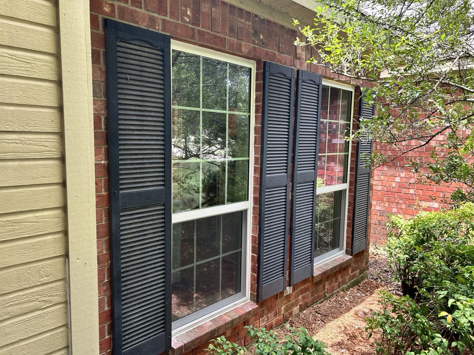 Replacement windows installed on a brick home